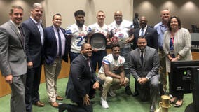 SMU football shows off Iron Skillet at Dallas City Council meeting after defeating TCU