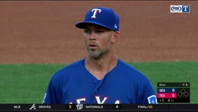 Minor stays with Rangers and stops Mariners' win streak, 9-7