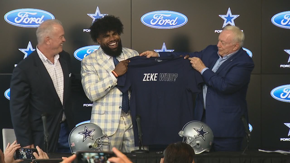 Jerry Jones gives Ezekiel Elliott a ‘Zeke Who?' shirt at contract extension press conference