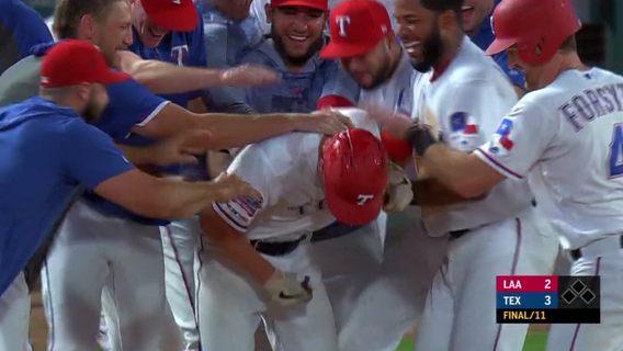 Rookies push Rangers to 3-2 win for split of DH with Angels