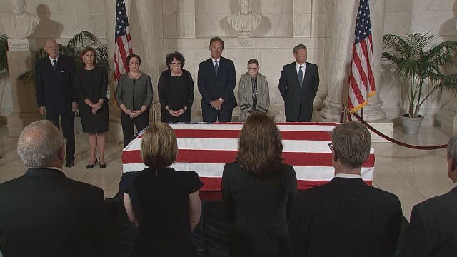 Retired Supreme Court Justice John Paul Stevens lies in repose; colleagues pay respects