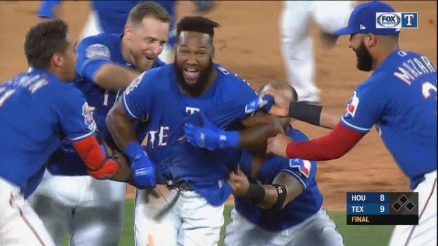 Rangers rally from 4 down to beat Astros 9-8 on Santana hit