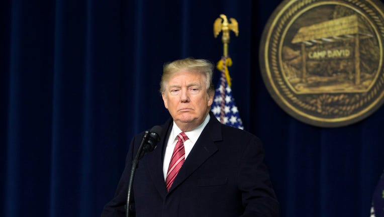 U.S. President Donald Trump speaks to the press after holding meetings at Camp David on January 6, 2018.