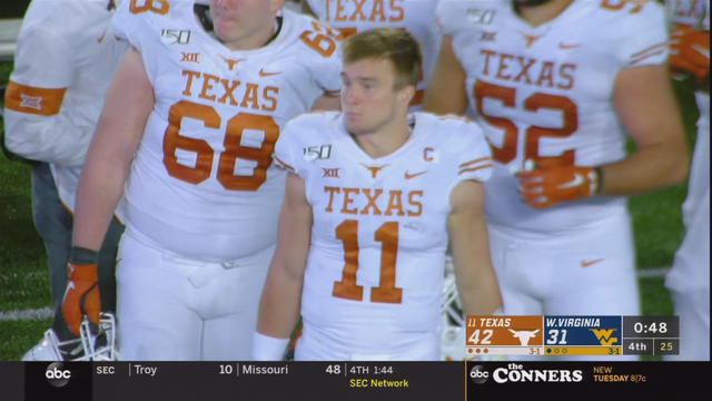 Ehlinger leads No. 11 Texas over West Virginia 42-31