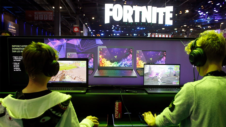 Gamers play 'Fortnite,' developed by Epic Games, during the 2018 'Paris Games Week' in Paris France. A lawsuit has been filed against Epic Games alleging the company 'knowingly' made an 'addictive game.'