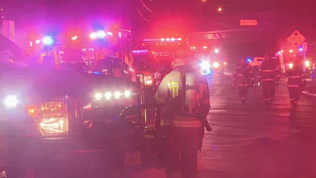 Crews battle four-alarm warehouse fire near Fair Park