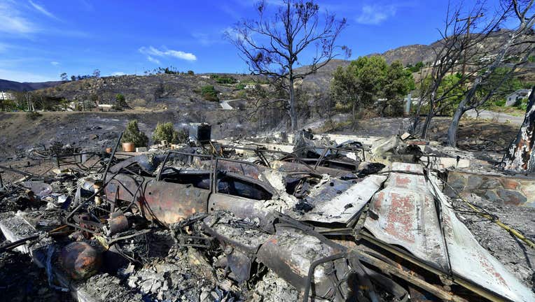 A collapsed garage door is recognizable amid the rubble of a house off Encinal Canyon Road destroyed by the Woolsey Fire in Malibu, California on November 15, 2018. - Parts of the area remain under evacuation one week after the Woolsey Fire started. (Photo by Frederic J. BROWN / AFP) (Photo credit should read FREDERIC J. BROWN/AFP via Getty Images)