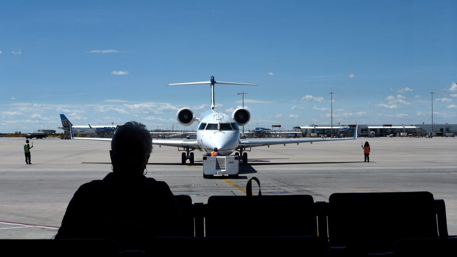 A passenger waits for her flight to board in a file image taken at Denver International Airport in Denver, Colorado. (Photo by Robert Alexander/Getty Images)