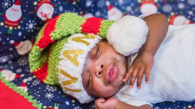NICU babies at Methodist Dallas outfitted with Santa hats handmade by nurses