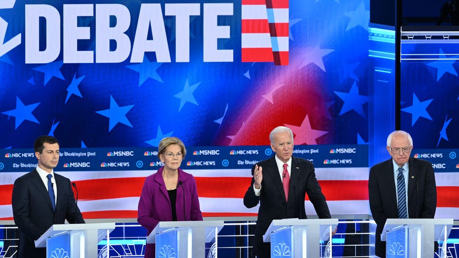 Democratic presidential hopefuls (L-R) South Bend, Indiana, Mayor Pete Buttigieg, Massachusetts Sen. Elizabeth Warren, former Vice President Joe Biden and Vermont Sen. Bernie Sanders are pictured during the fifth Democratic primary debate on Nov. 20, 2019 in Atlanta, Georgia. (Photo by SAUL LOEB/AFP via Getty Images)