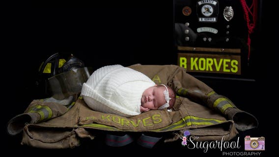 Late firefighter's newborn daughter has moving photo shoot with dad's firehouse brothers