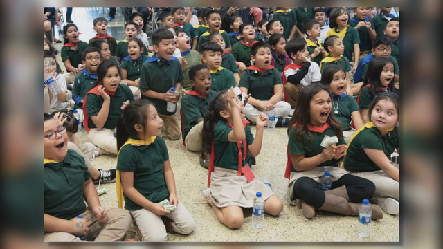 Dallas and Chicago area student athletes team up to surprise 2nd graders with new bikes
