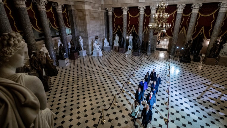 House Sergeant of Arms Paul Irving, Clerk of the House of Representatives Cheryl Johnson, House impeachment managers Rep. Adam Schiff (D-CA), Rep. Jerry Nadler (D-NY), Rep. Zoe Lofgren (D-CA), Rep. Hakeem Jeffries (D-NY), Rep. Val Demings (D-FL), Rep. Jason Crow (D-CO) and Rep. Sylvia Garcia (D-TX) carry the articles of impeachment through Statuary Hall as they pass from the House to the Senate at the U.S. Capitol.