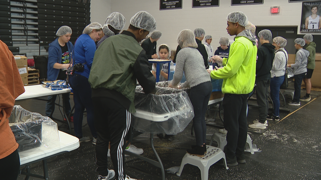 Bishop Lynch HS community packs meals sent to hungry children all over the world