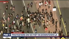 Hundreds of protesters gather in downtown LA to rally against death of George Floyd