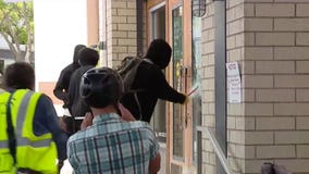 Protesters try to stop looting at Third Street Promenade in Santa Monica