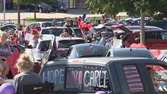 Drive-thru graduation celebration held for Trinity High School seniors in Euless