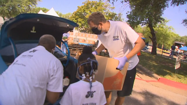 Dirk and his wife, Jessica, among those who volunteered to help give out Mother's Day meal boxes