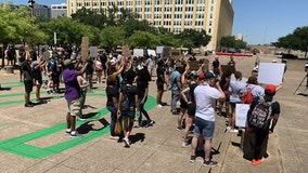 Some protesters call on Dallas Police Chief Renee Hall to resign during rally outside city hall