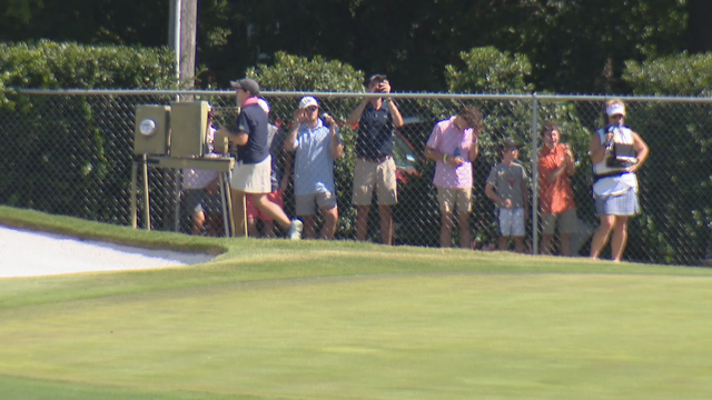 Colonial spectators in bushes and temporary tents off course
