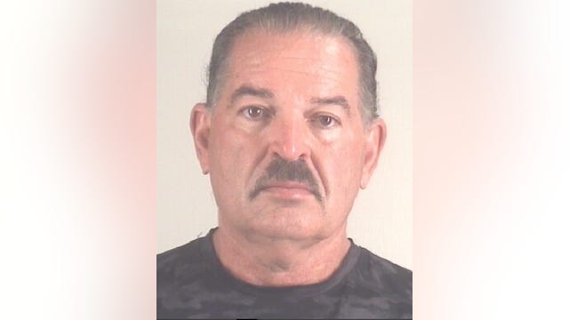 Arlington man charged in connection with body found in container