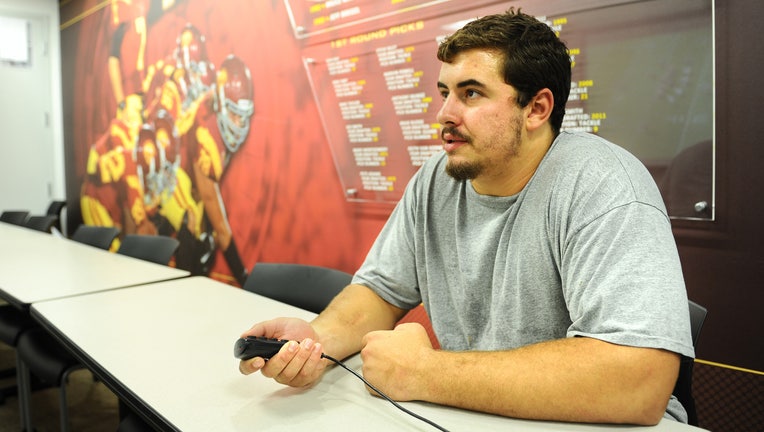 LONG BEACH, CALIFORNIA JULY 21, 2014-USC center Max Tuerk watches game film at the USC campus. Turek