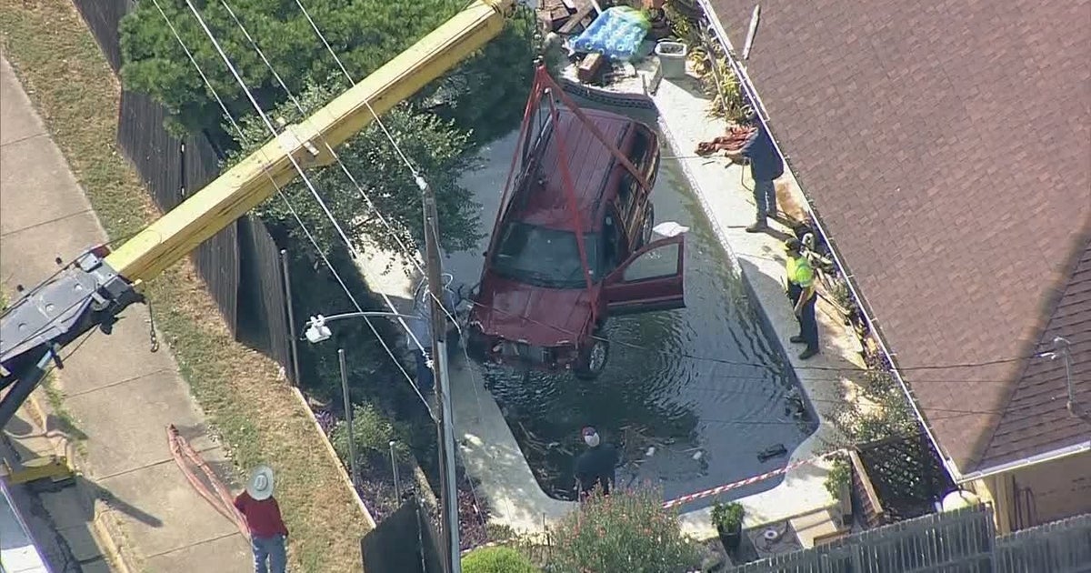 SUV crashes through fence, lands in Arlington backyard pool | FOX 4 ...