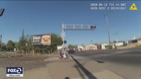 VIDEO: California police officer whisks man in wheelchair off train tracks just in time