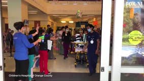 Hospital staff cheers as 13-year-old COVID-19 survivor is discharged after 57 days in ICU