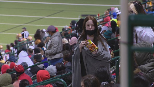 High school football fans enjoy chilly weather in the stands Friday night
