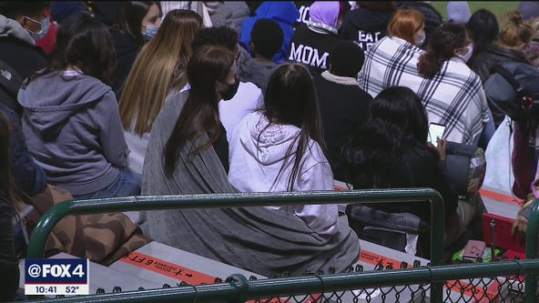 High school football fans enjoy chilly weather in the stands Friday night