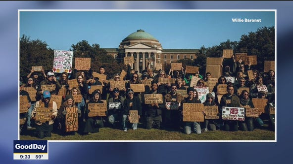 SMU professor buys signs from the homeless to help raise awareness