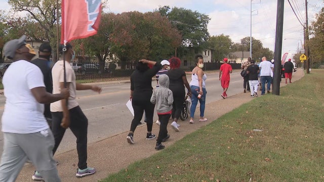 Group holds unity walk in South Dallas to reclaim the area as a place of peace