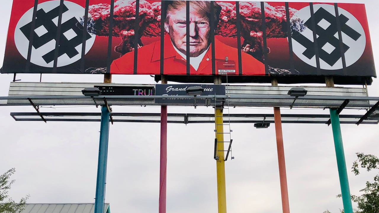 New billboard in downtown Phoenix shows Trump behind bars in prison