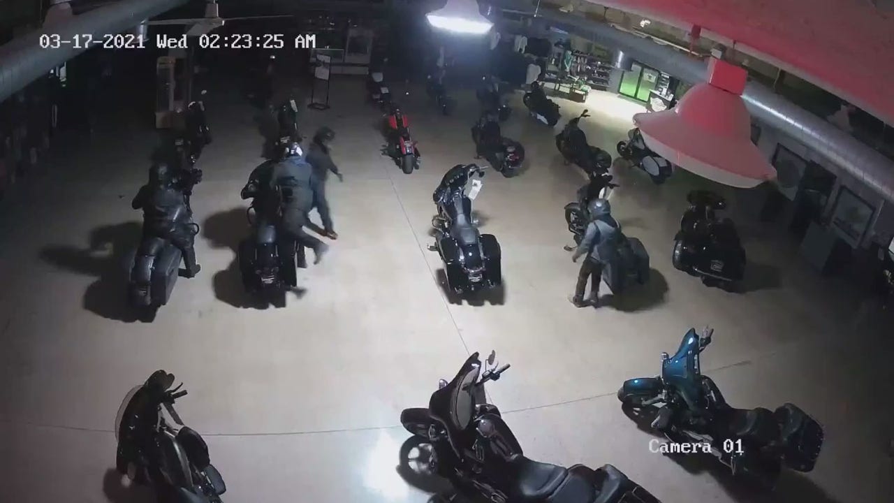Burglars drive motorcycles at the front door of the Harley-Davidson dealership in Indiana