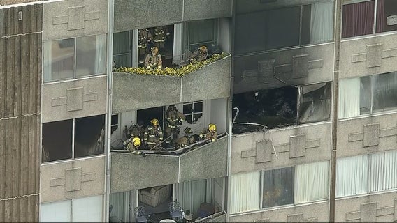 Firefighters help elderly residents evacuate during Dallas high-rise apartment fire
