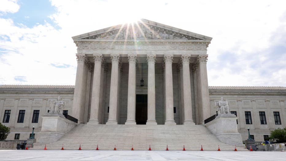 The sun rises behind the U.S. Supreme Court on June 10, 2021, in Washington, D.C. (Photo by Kevin Dietsch/Getty Images)