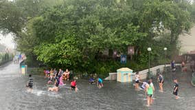 PHOTOS: Kids swim in flooded streets at Disney's Magic Kingdom