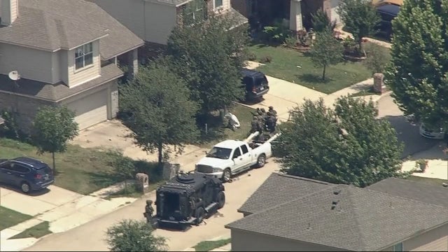 Man arrested for shooting at police, code compliance crew over unkept lawn