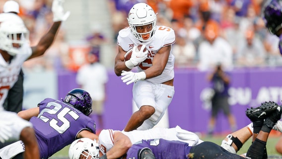 Robinson runs for 216 yards, 2 TDs as Texas beats TCU 32-27