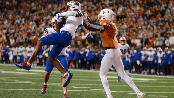 Kansas snaps losing skid and stuns Texas 57-56 in OT