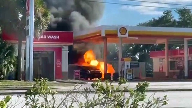 Fire erupts after driver backs into gas pump, killing woman pumping gas