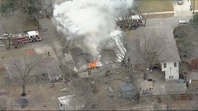 Dallas firefighters pull man from burning home