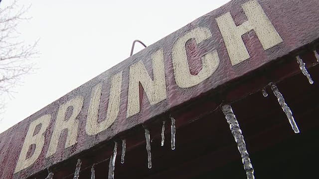 While most stay home, some Dallas pedestrians venture out in icy weather