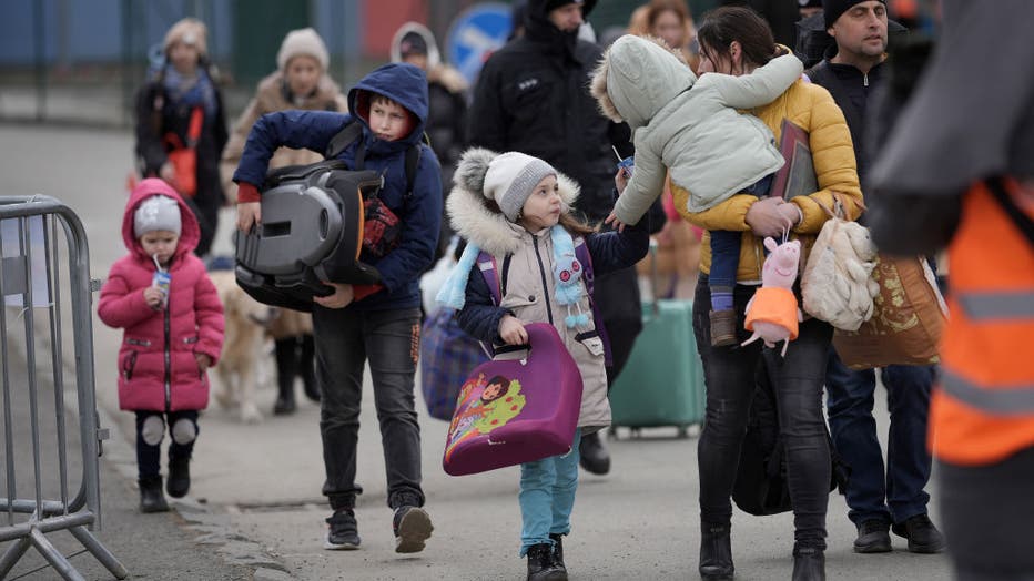 VYSNE NEMECKE, SLOVAKIA - MARCH 09: Refugees fleeing Ukraine arrive at the Vysne Nemecke border crossing on March 9, 2022, in Vysne Nemecke, Slovakia. (Photo by Christopher Furlong/Getty Images)