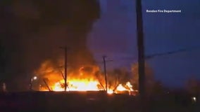 VIDEO: Tornado threatens firefighters battling wooden pallet fire
