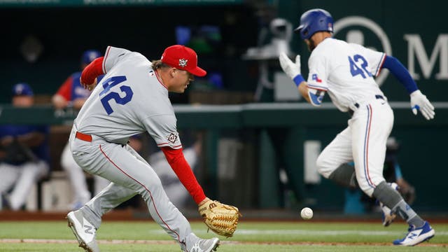 Angels issue intentional walk with bases loaded, beat Rangers 9-6
