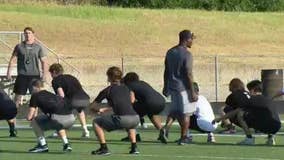 High school athletes endure workouts in the Texas heat
