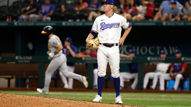 Pinder's 12th-inning slam lifts A's over Rangers 14-7