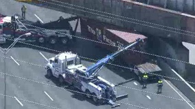 18-wheeler stuck under I-35E bridge causes large backup in Dallas